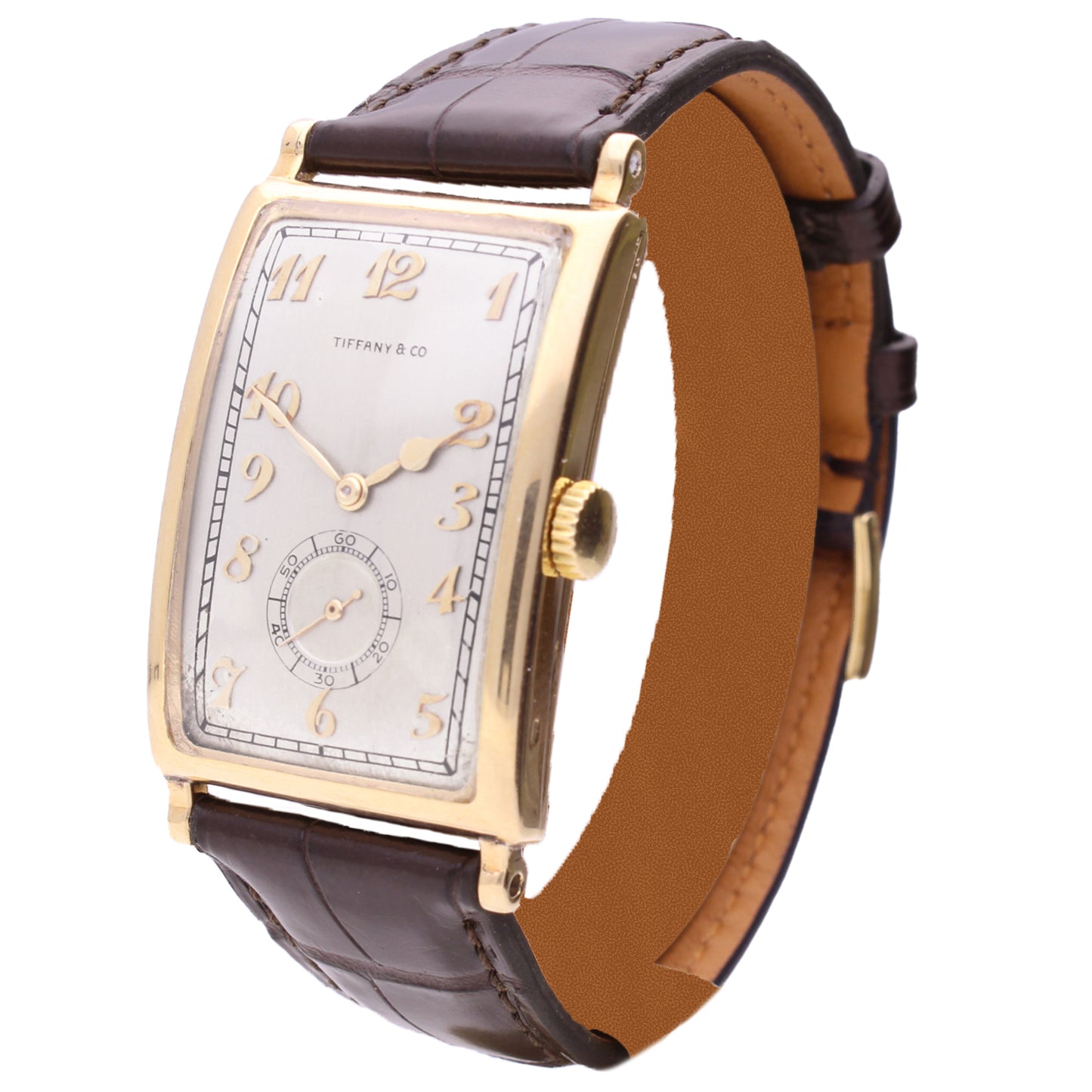 18ct yellow gold Patek Philippe, ref. 431 rectangular curved wristwatch, retailed by TIFFANY. Made 1940