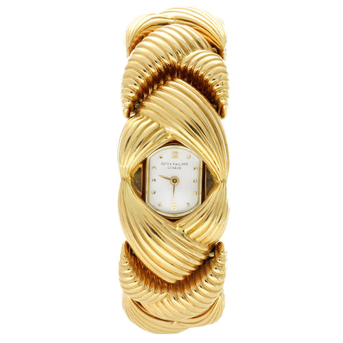 18ct rose gold Patek Philippe ref. 3100 'Scallop' link bracelet watch. Made 1958