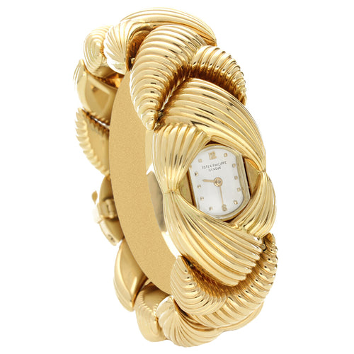 18ct rose gold Patek Philippe ref. 3100 'Scallop' link bracelet watch. Made 1958