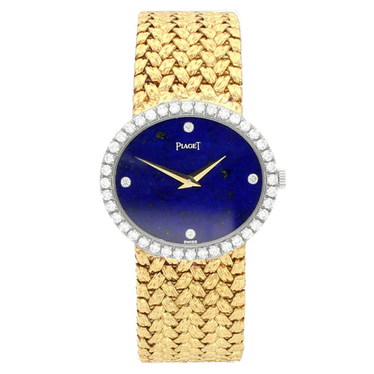 18ct yellow gold Piaget ref. 9806 'oval cased' bracelet watch with lapis lazuli dial and diamond set bezel. Made 1970s