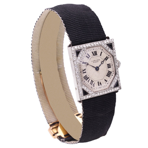 Platinum Cartier onyx and diamond wristwatch. Made 1920