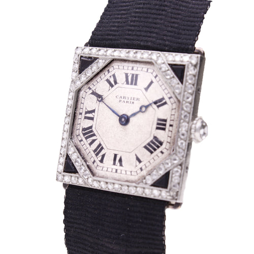 Platinum Cartier onyx and diamond wristwatch. Made 1920