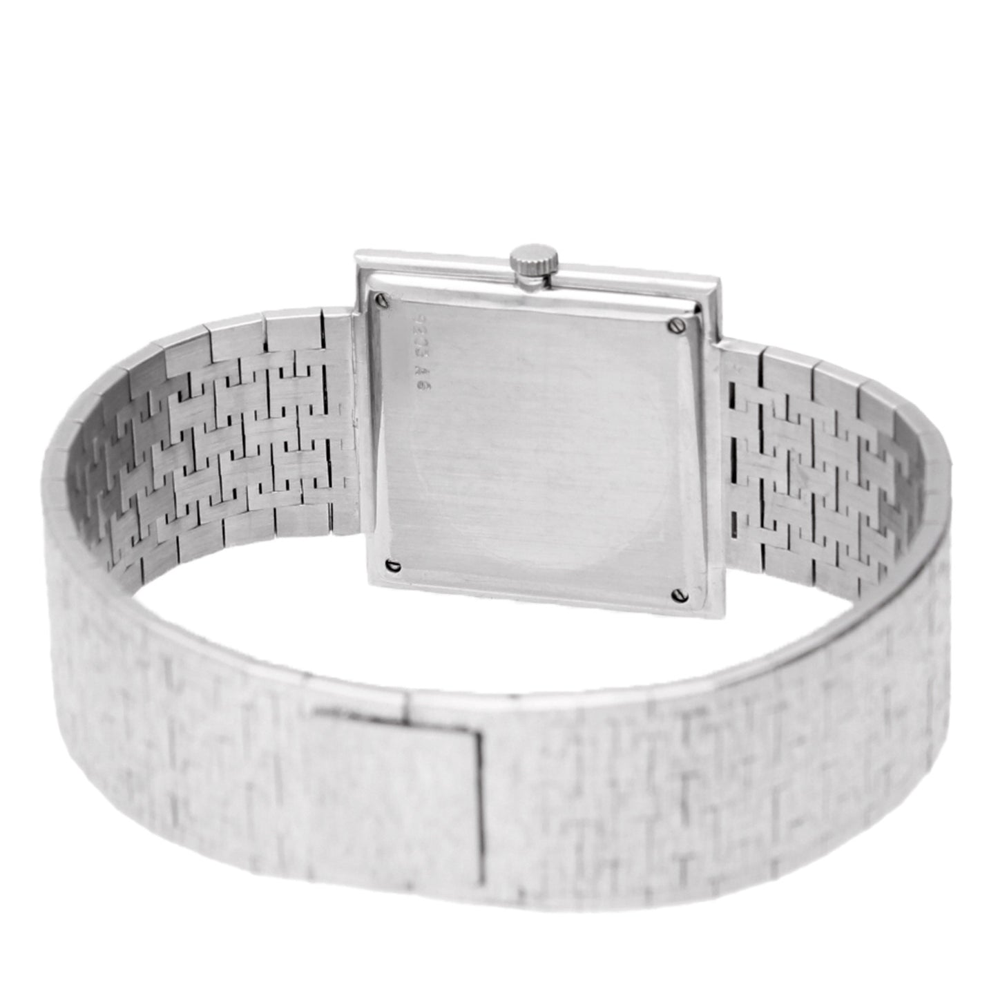 18ct white gold Piaget ref. 9203 square case bracelet watch with diamond and emerald set bezel. Made 1970