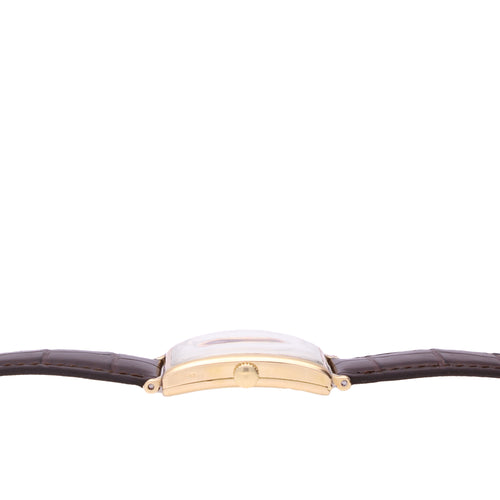 18ct yellow gold Patek Philippe, ref. 431 rectangular curved wristwatch, retailed by TIFFANY. Made 1940
