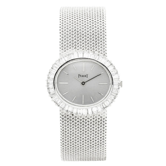 18ct white gold Piaget ref. 9322 'oval cased' and diamond set bezel bracelet watch. Made 1970s