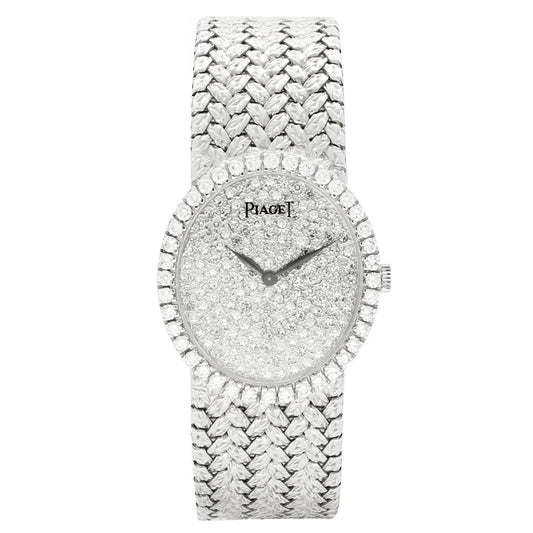 18ct white gold Piaget, oval bracelet watch with diamond set dial and bezel. Made 1970s