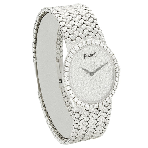 18ct white gold Piaget, oval bracelet watch with diamond set dial and bezel. Made 1970s