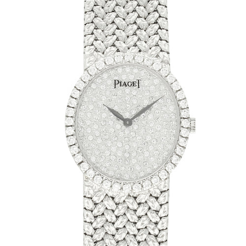 18ct white gold Piaget, oval bracelet watch with diamond set dial and bezel. Made 1970s