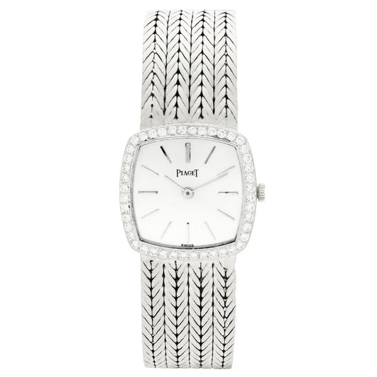 18ct white gold 'cushion cased' Piaget, with silvered dial and diamond set bezel bracelet watch. Made 1970's