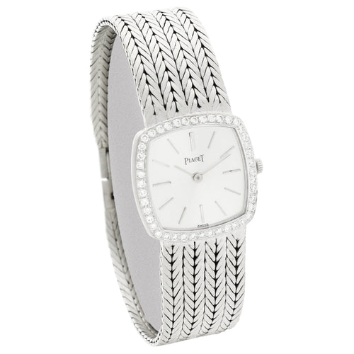 18ct white gold 'cushion cased' Piaget, with silvered dial and diamond set bezel bracelet watch. Made 1970's