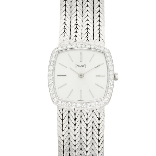 18ct white gold 'cushion cased' Piaget, with silvered dial and diamond set bezel bracelet watch. Made 1970's