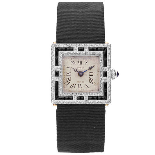 Platinum Cartier onyx and diamond set cocktail watch. Made 1920's
