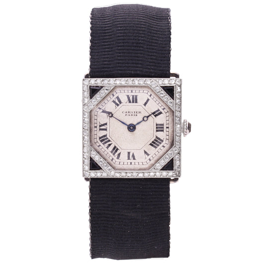 Platinum Cartier onyx and diamond wristwatch. Made 1920