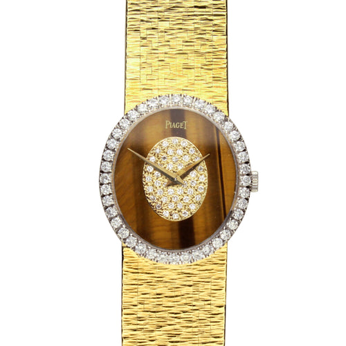 18ct yellow gold Piaget ref. 9826 bracelet watch with tigers eye/diamond set dial and diamond set bezel. Made 1970's