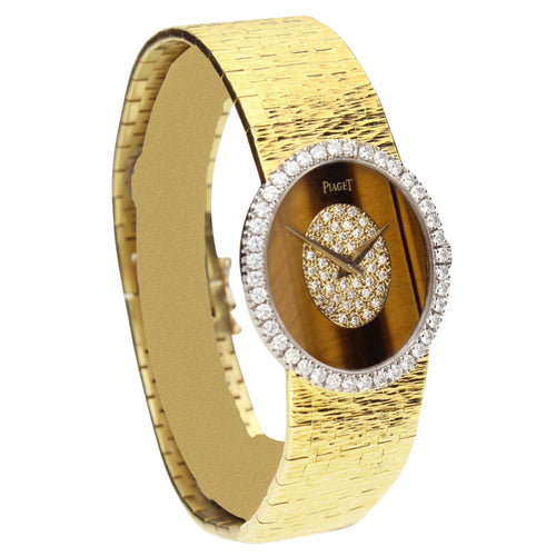 18ct yellow gold Piaget ref. 9826 bracelet watch with tigers eye/diamond set dial and diamond set bezel. Made 1970's