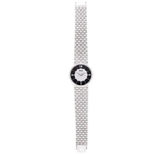 18ct white gold Piaget ref. 9066 bracelet watch with onyx dial and diamond set bezel. Made 1989