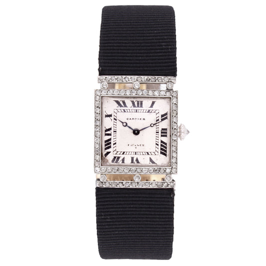 Platinum Cartier diamond and onyx bezel wristwatch. Made 1920