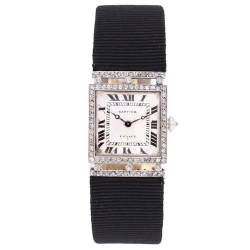 Platinum Cartier, diamond and onyx bezel wristwatch. Made 1920
