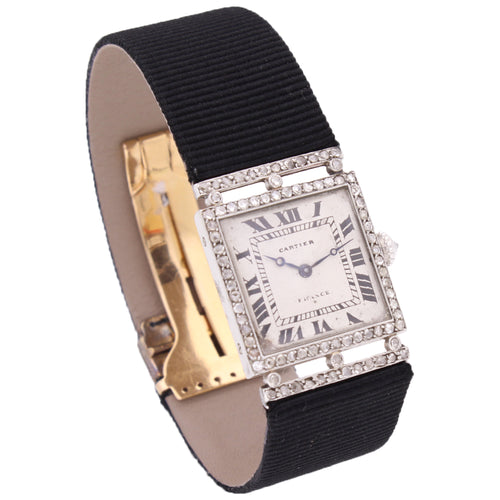 Platinum Cartier, diamond and onyx bezel wristwatch. Made 1920