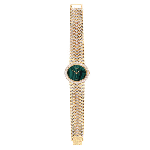 Tri-gold Piaget ref. 98125 'oval cased' bracelet watch with malachite dial and diamond set bezel. Made 1970's