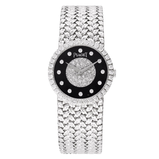 18ct white gold Piaget bracelet watch with onyx & diamond set dial. Made 1970