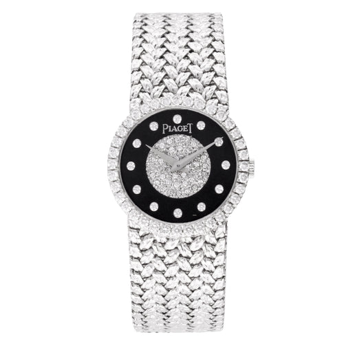 18ct white gold Piaget bracelet watch with onyx & diamond set dial. Made 1970