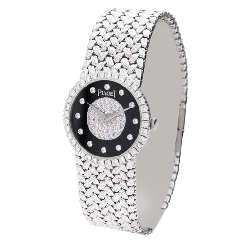 18ct white gold Piaget bracelet watch with onyx & diamond set dial. Made 1970