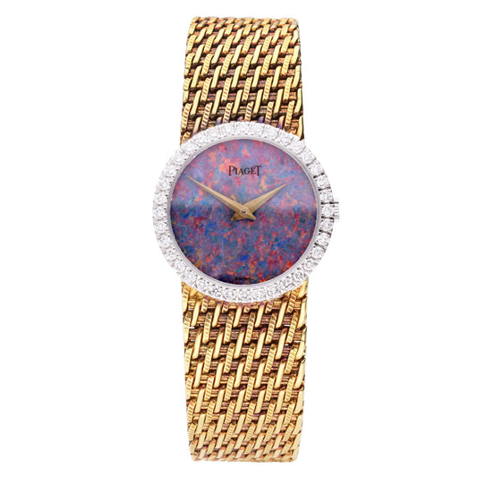 18ct yellow gold Piaget bracelet watch with an opal dial & diamond set bezel. Made 1970