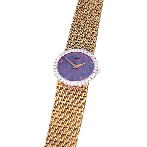 18ct yellow gold Piaget bracelet watch with an opal dial & diamond set bezel. Made 1970