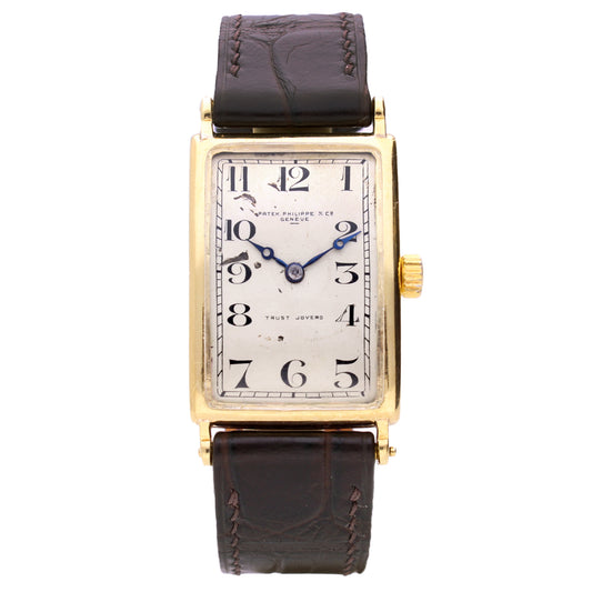 18ct yellow gold Patek 'rectangular curved' wristwatch, retailed by TRUST JOYERO. Made 1920