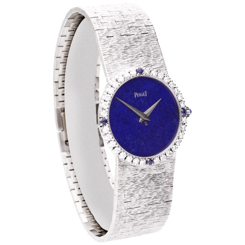 18ct white gold Piaget ref. 9706 bracelet watch with lapis lazuli dial and diamond set bezel with sapphire quarters. Made 1970