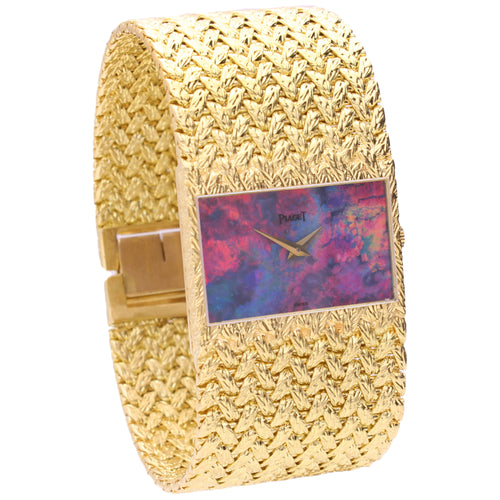 18ct yellow gold Piaget ref. 92120 cuff watch with opal dial. Made 1972