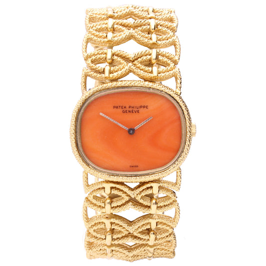 18ct yellow gold Patek Philippe ref. 4267/1 bracelet watch with coral dial. Made 1977