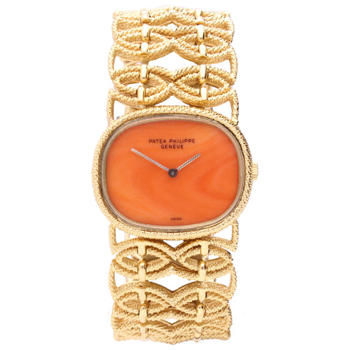 18ct yellow gold Patek Philippe ref. 4267/1 bracelet watch with coral dial. Made 1977