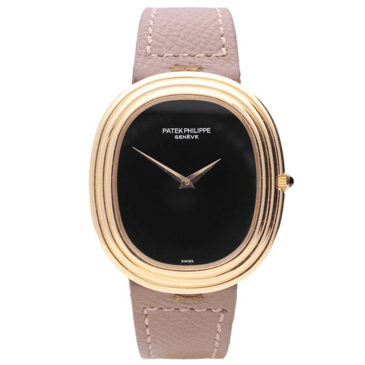 18ct yellow gold Patek Philippe ref. 3634 Ellipse automatic wristwatch with onyx dial and onyx set crown. Made 1973