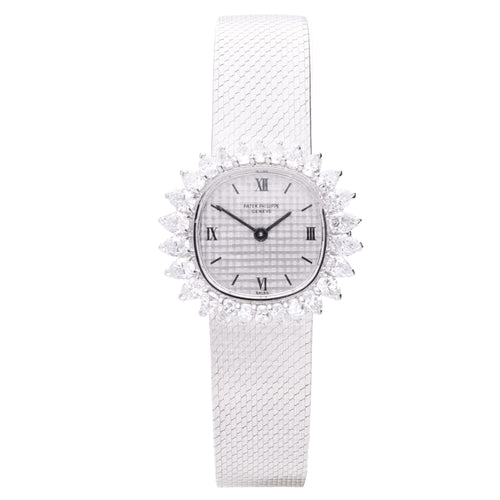 18ct white gold Patek Philippe bracelet watch with 'tapestry' dial and diamond set bezel. Made 1968