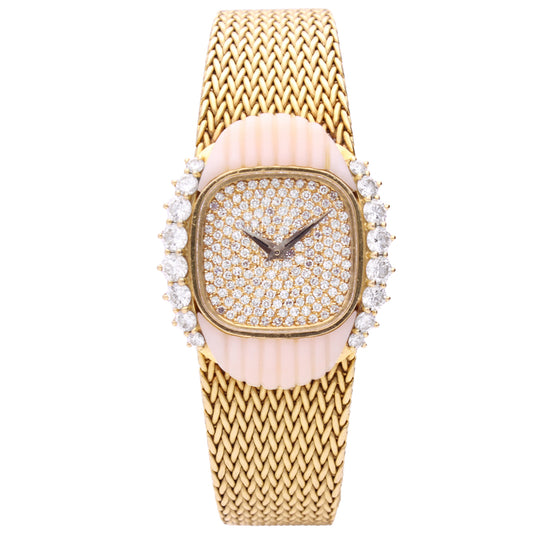 18ct yellow gold Patek Philippe bracelet watch ref. 4301/3 with pavé diamond set dial and coral/diamond set bezel. Made 1984
