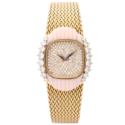 18ct yellow gold Patek Philippe bracelet watch ref. 4301/3 with pavé diamond set dial and coral/diamond set bezel. Made 1984
