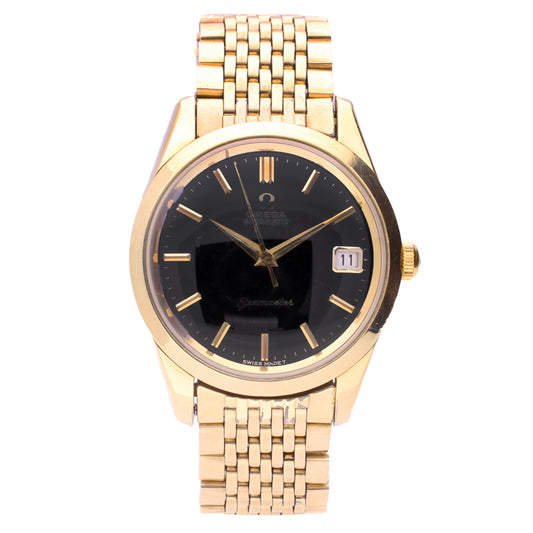 Gold plated OMEGA Seamaster automatic wristwatch with black dial and date. Made 1964