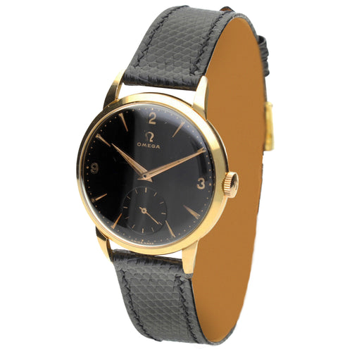 18ct yellow gold OMEGA black dial dress wristwatch. Made 1955